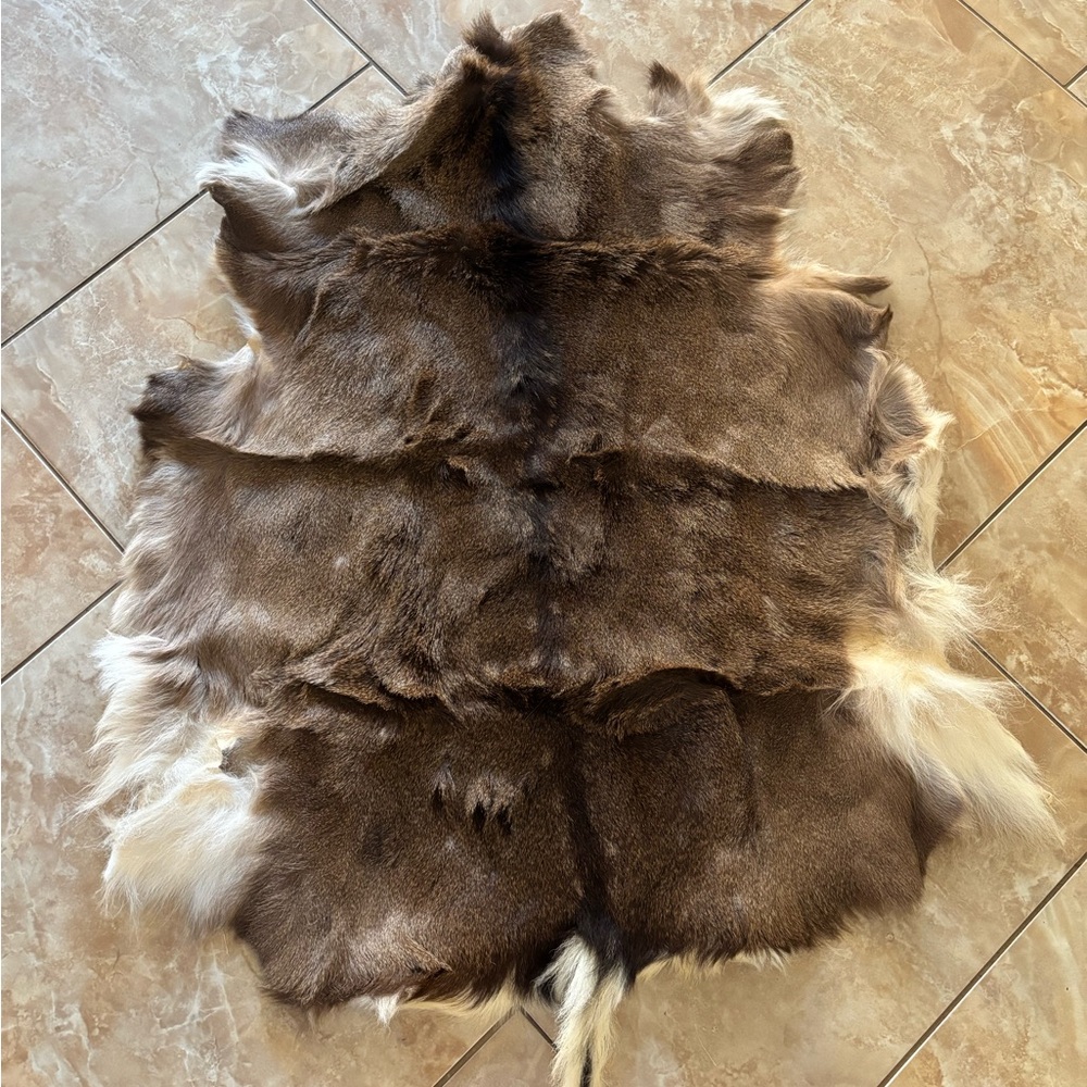 Brown and White Animal Hide Rug